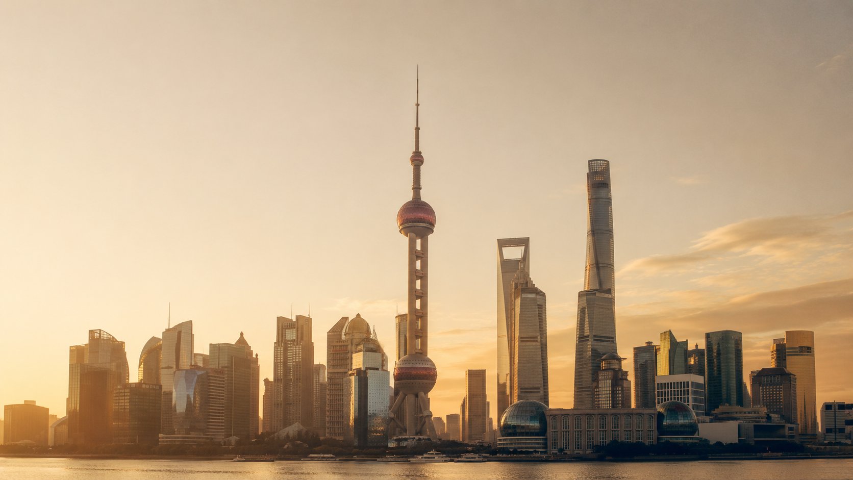 Shanghai skyline at golden hour, with the Oriental Pearl Tower and Shanghai Tower